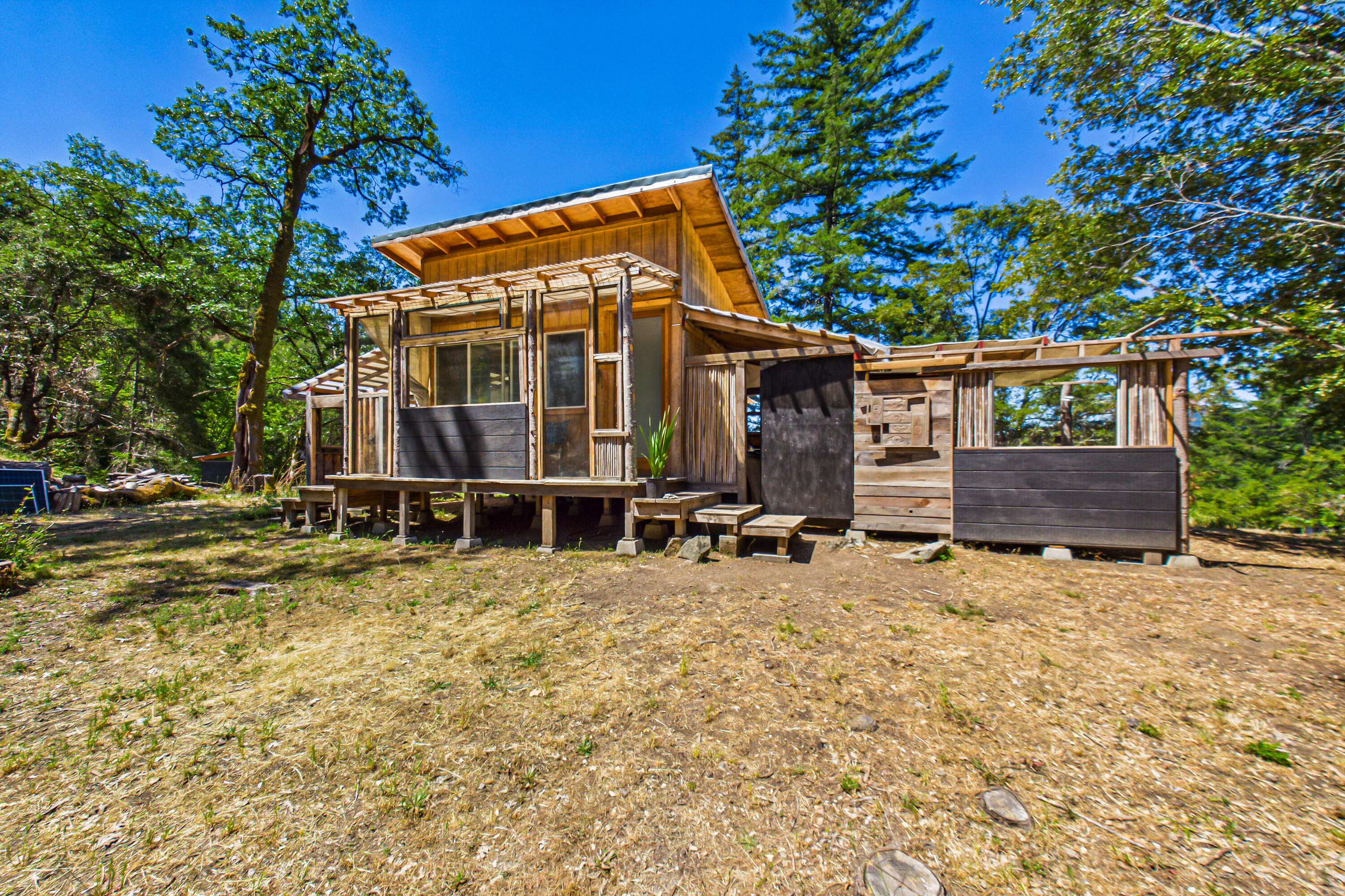 60890 Bell Springs Road Laytonville, CA 95454 - Photo 7 of 77 a view of a house with backyard and sitting area