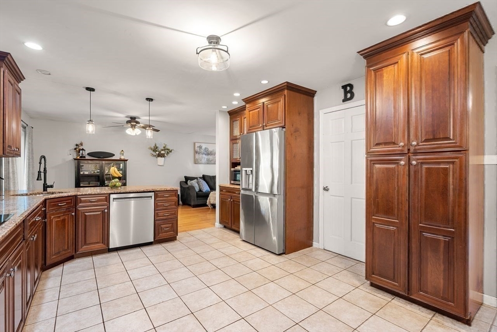 29 Charlotte Road Ipswich, MA 01938 - Photo 8 of 42 a kitchen with stainless steel appliances granite countertop a refrigerator and a sink