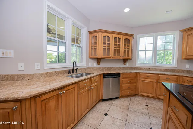 a white toilet sitting next to a bath tub