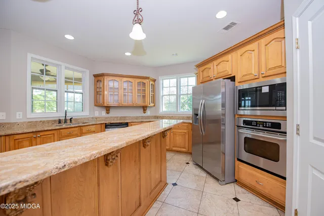 a view of a hallway with stairs
