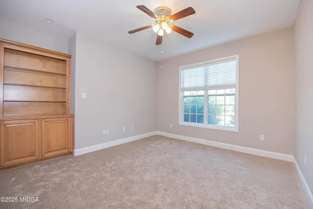 a spacious bathroom with a double vanity sink mirror and next to a window