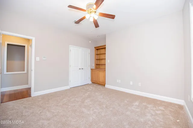 a white toilet sitting next to a bath tub