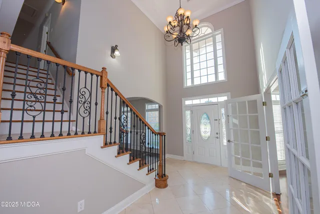a large spacious bathroom with a tub sink and mirror
