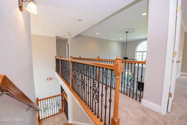 a large spacious bathroom with a tub sink and mirror