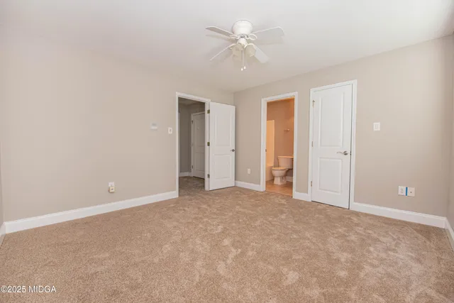 a kitchen with a stove a sink and a microwave