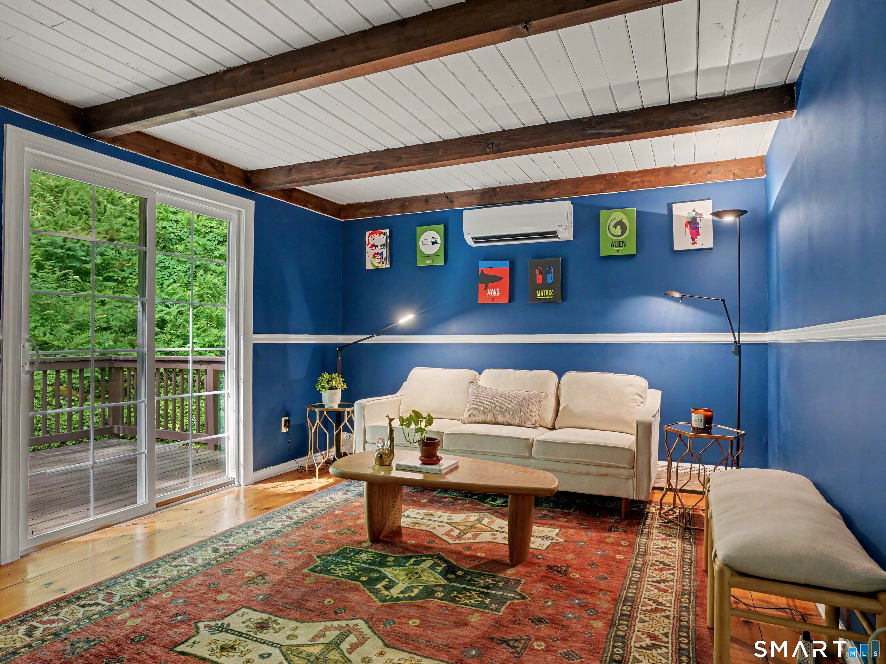252 Bennetts Farm Road Ridgefield, CT 06877 - Photo 12 of 40 The Main Floor includes two Bedrooms, each with an Ensuite Bathroom. This Bedroom, which also has a deck, is being used as a Family Room right now.