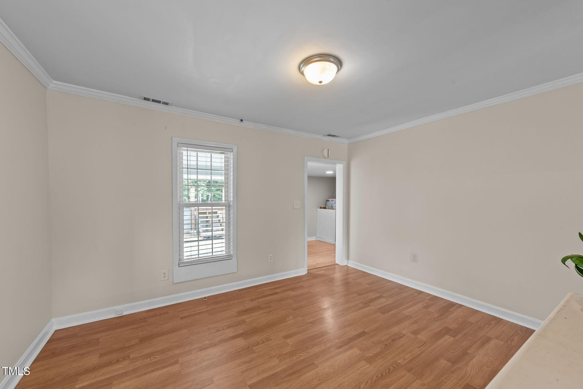 1425 Langdon Road Angier, NC 27501 - Photo 12 of 55 an empty room with wooden floor and windows