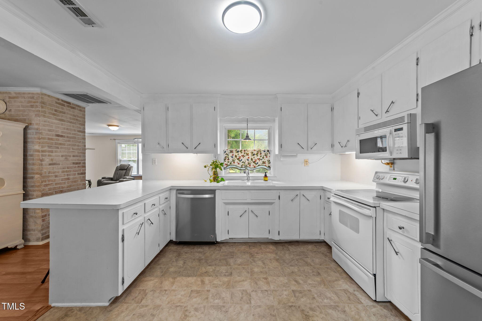 1425 Langdon Road Angier, NC 27501 - Photo 15 of 55 a kitchen with granite countertop a sink stove and refrigerator