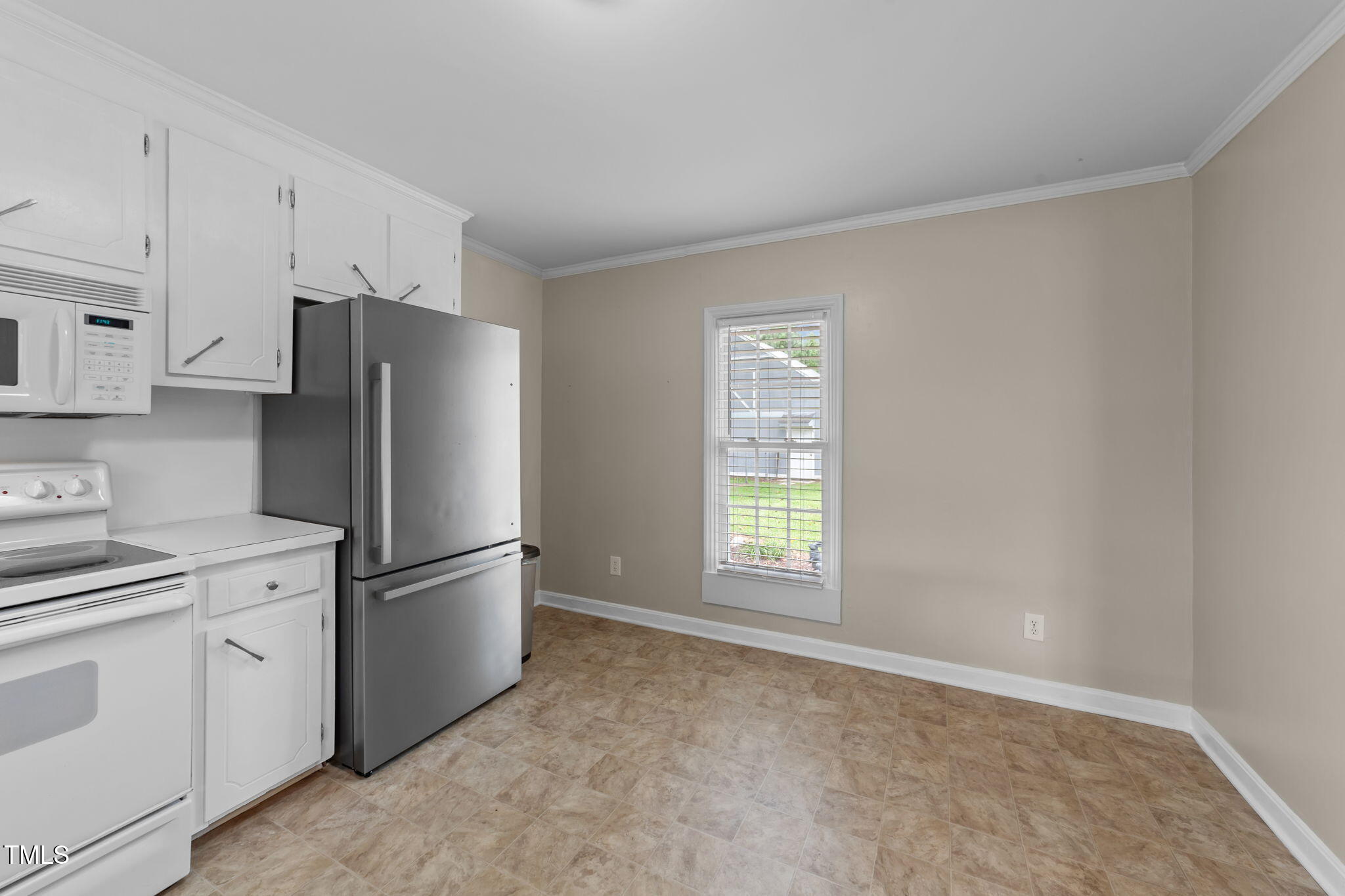 1425 Langdon Road Angier, NC 27501 - Photo 19 of 55 a kitchen with cabinets and stainless steel appliances