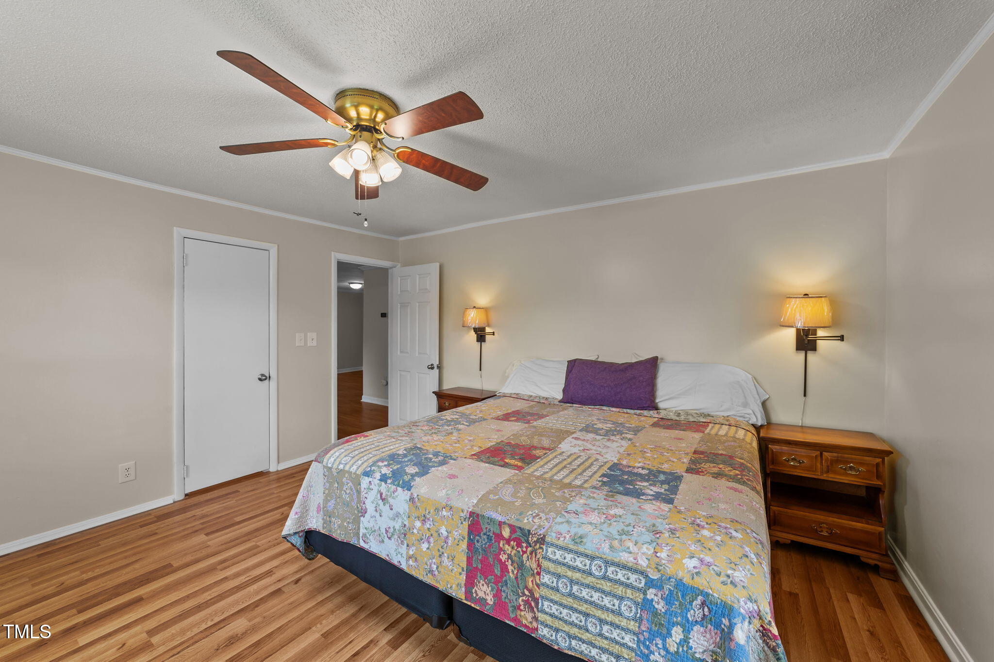 1425 Langdon Road Angier, NC 27501 - Photo 22 of 55 a bedroom with a bed and a chandelier