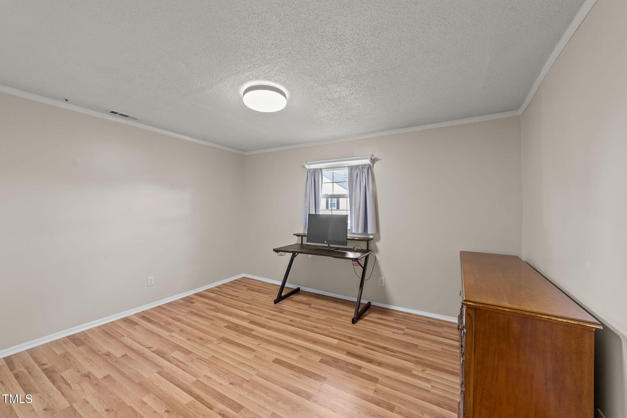 1425 Langdon Road Angier, NC 27501 - Photo 24 of 55 a room with a bed and a dresser