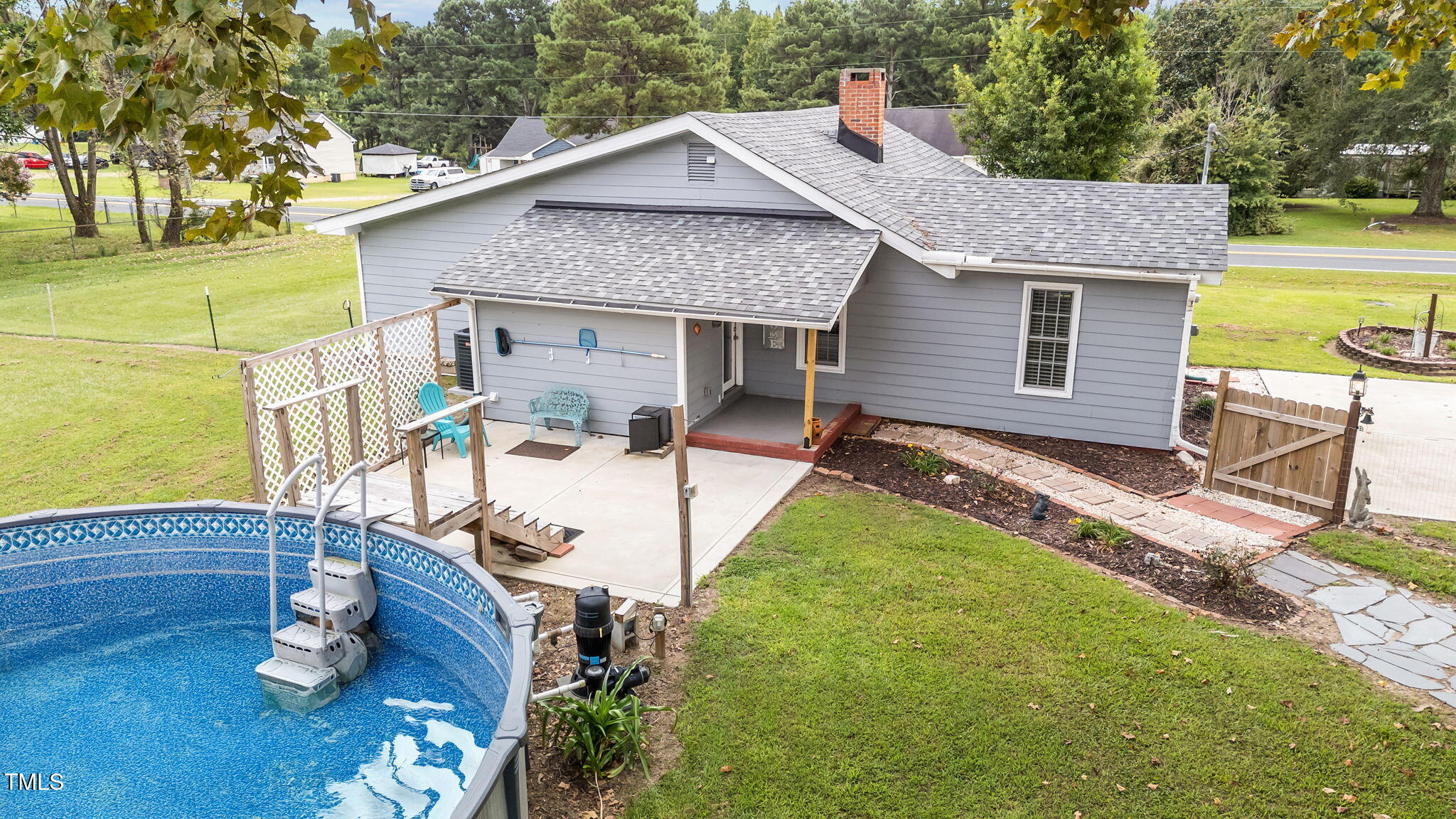 1425 Langdon Road Angier, NC 27501 - Photo 29 of 55 a view of a house with backyard and sitting area