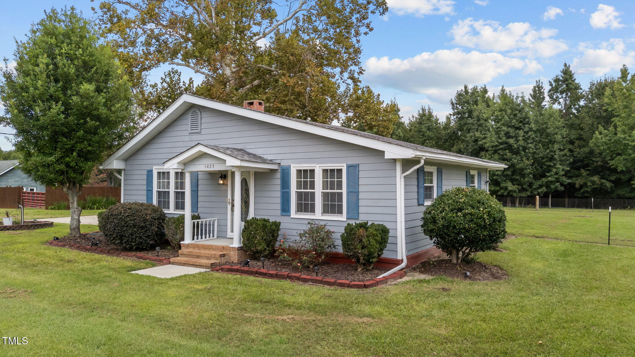 1425 Langdon Road Angier, NC 27501 - Photo 3 of 55 a view of a house with a yard and potted plants