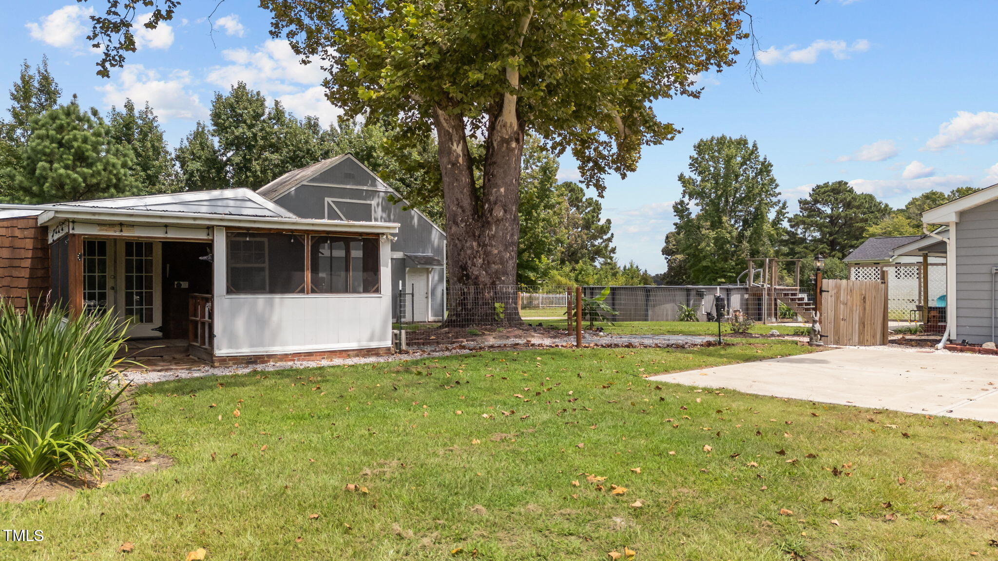 1425 Langdon Road Angier, NC 27501 - Photo 31 of 55 a view of a house with a yard and tree s