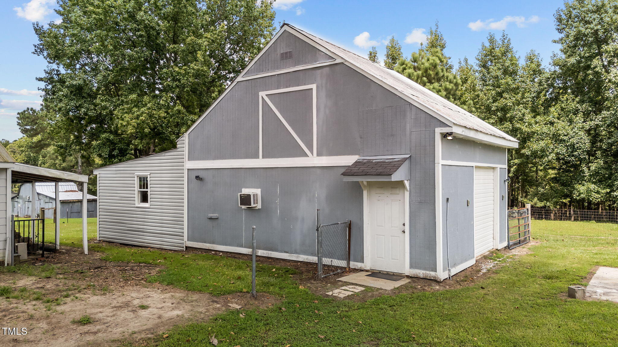 1425 Langdon Road Angier, NC 27501 - Photo 37 of 55 a backyard of a house with lots of green space