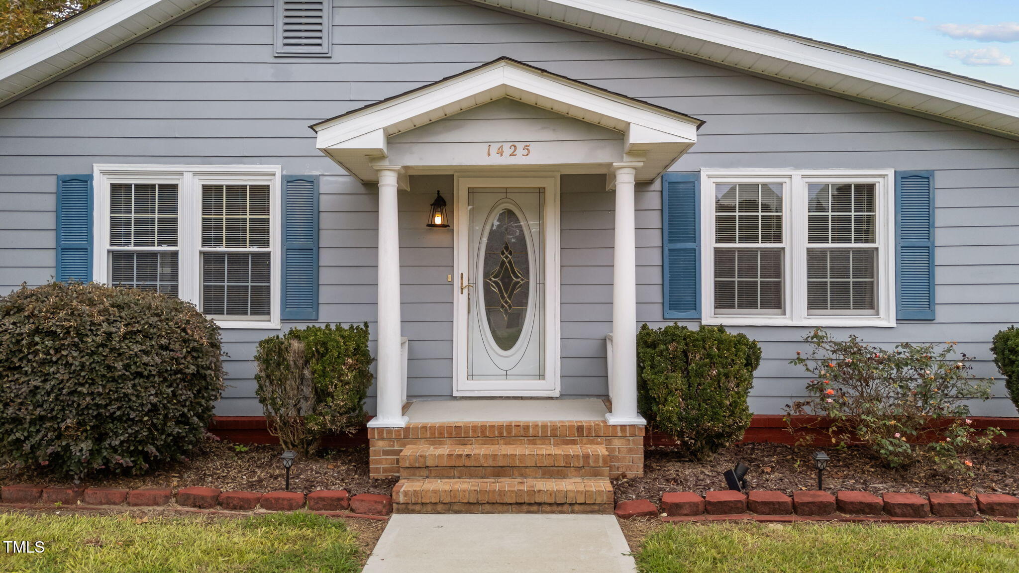 1425 Langdon Road Angier, NC 27501 - Photo 4 of 55 a front view of a house with garden