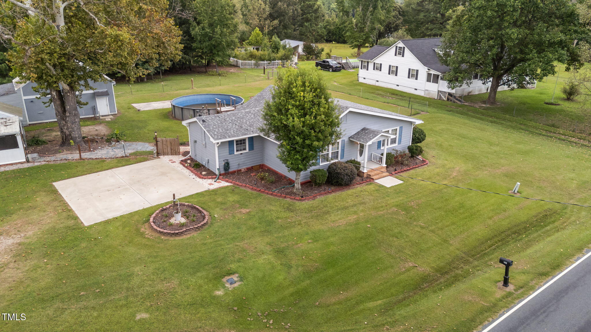 1425 Langdon Road Angier, NC 27501 - Photo 42 of 55 an aerial view of a house with swimming pool and outdoor space