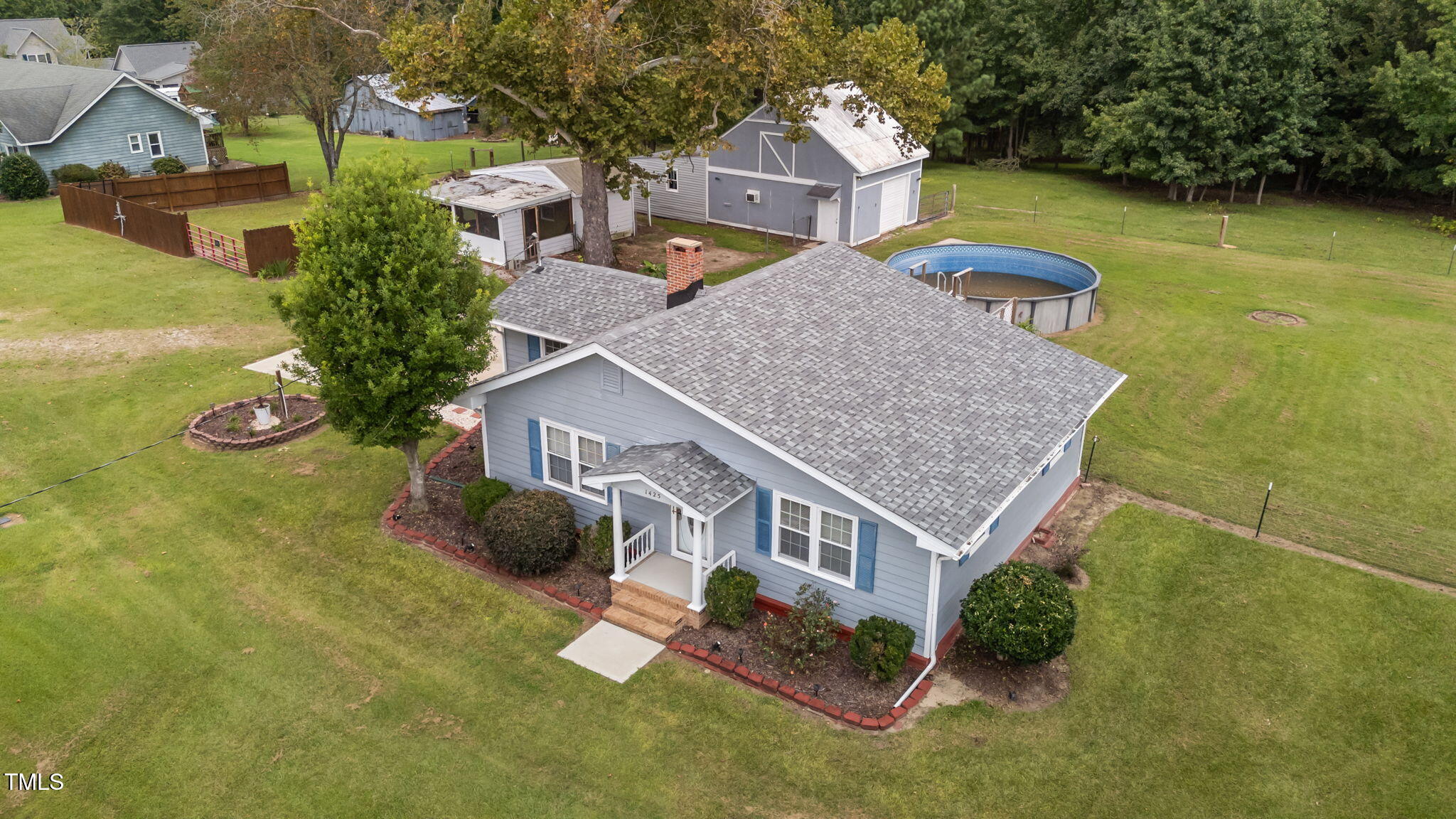 1425 Langdon Road Angier, NC 27501 - Photo 43 of 55 an aerial view of a house with swimming pool garden and lake view