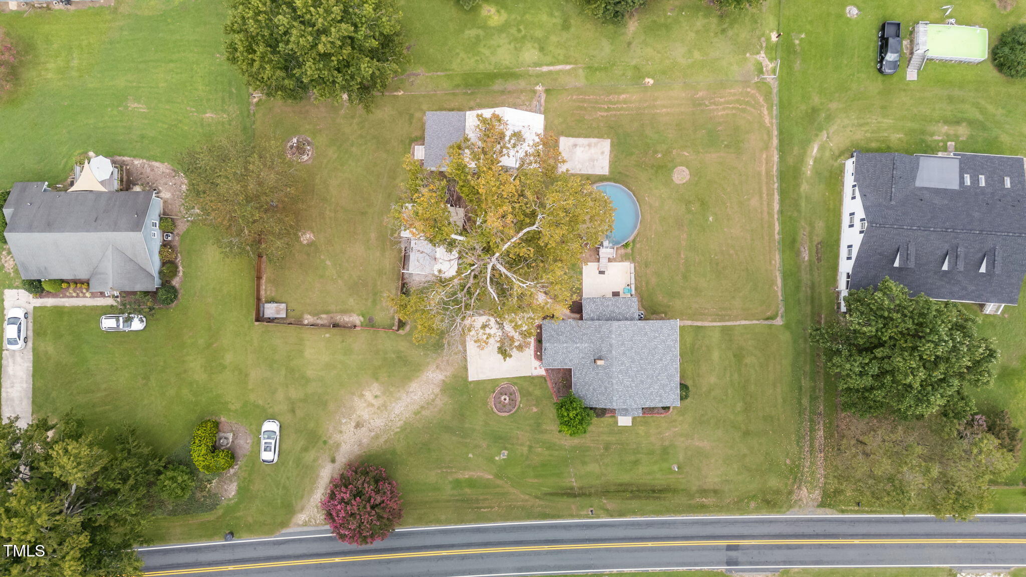 1425 Langdon Road Angier, NC 27501 - Photo 47 of 55 an aerial view of residential house with pool and yard