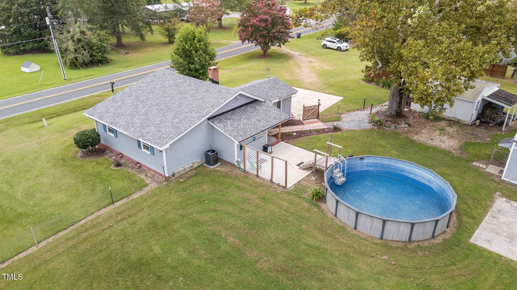 1425 Langdon Road Angier, NC 27501 - Photo 49 of 55 a view of a swimming pool with a yard and plants