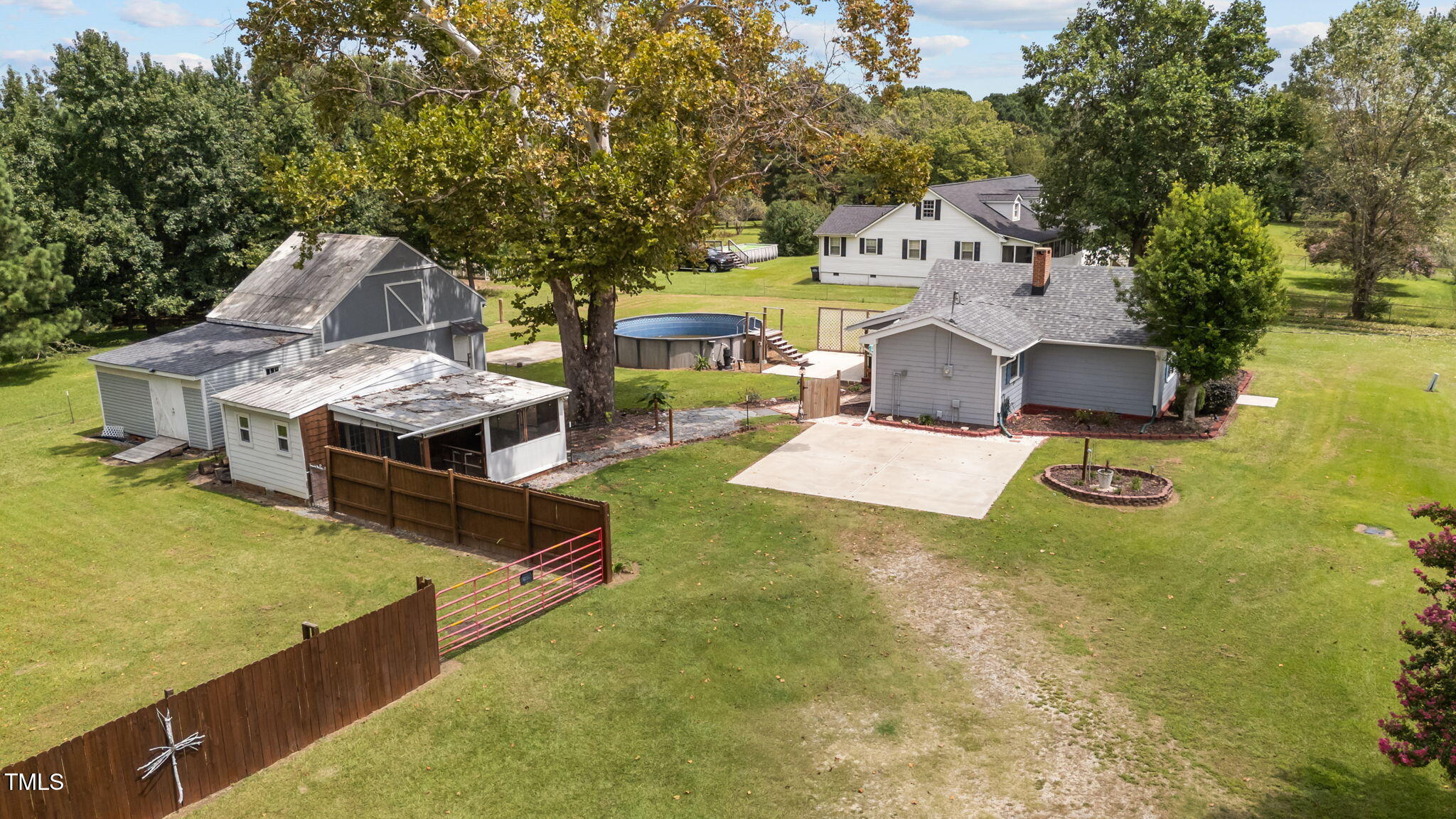 1425 Langdon Road Angier, NC 27501 - Photo 52 of 55 a aerial view of a house with swimming pool and big yard