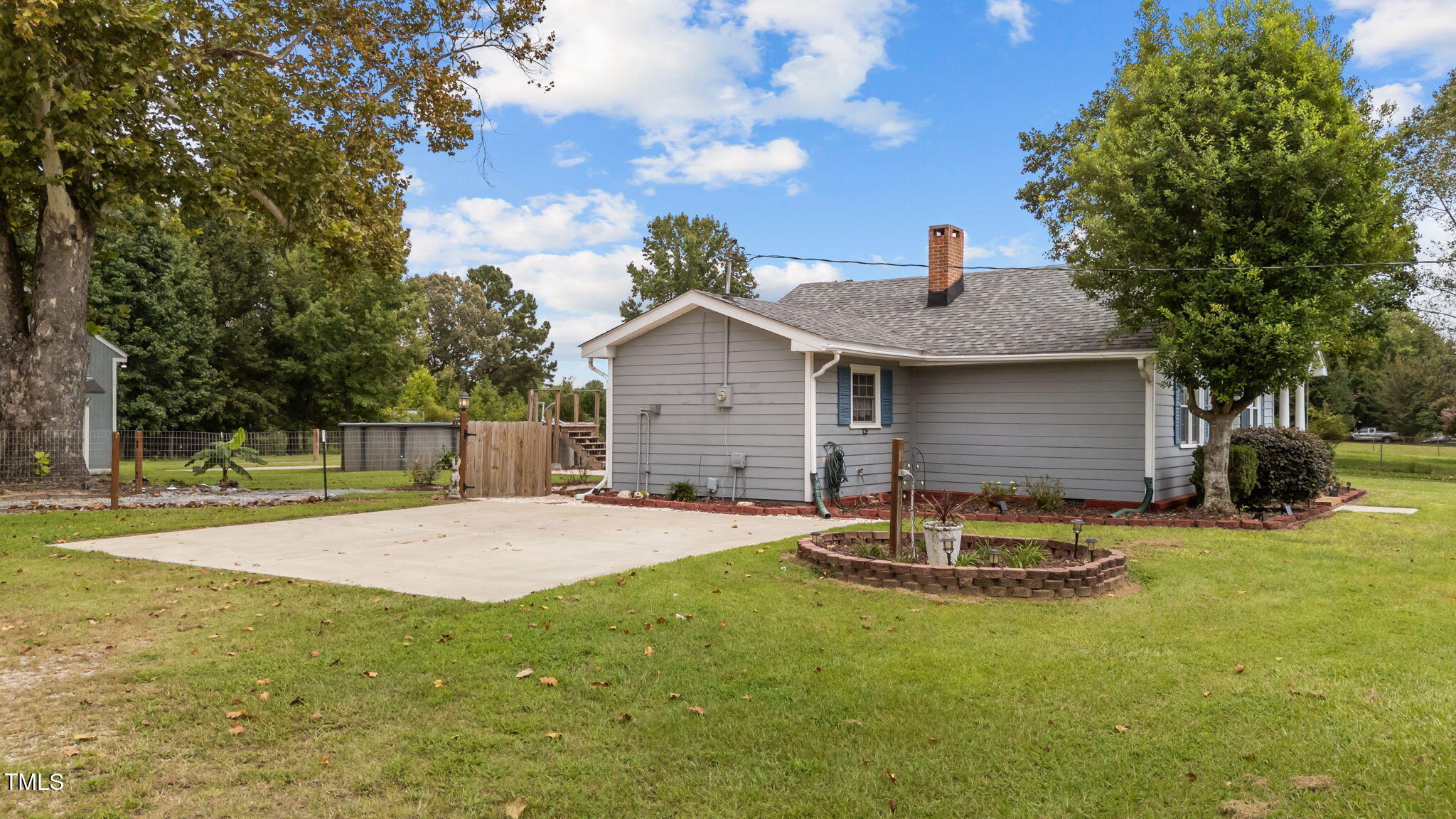 1425 Langdon Road Angier, NC 27501 - Photo 54 of 55 a house with garden in front of it