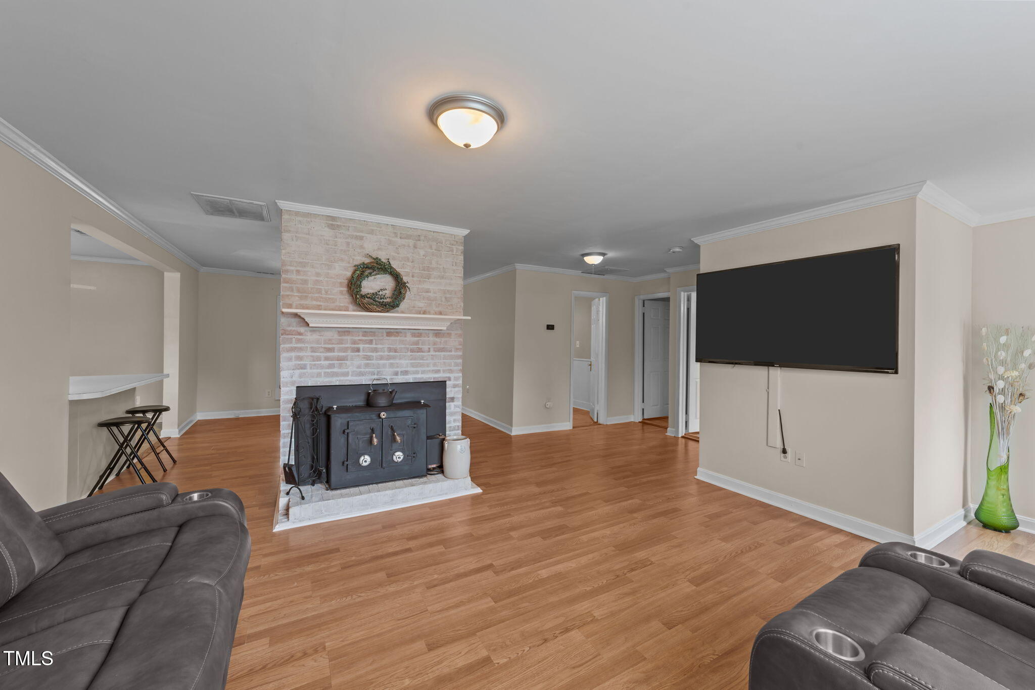 1425 Langdon Road Angier, NC 27501 - Photo 6 of 55 a living room with furniture fireplace and flat screen tv
