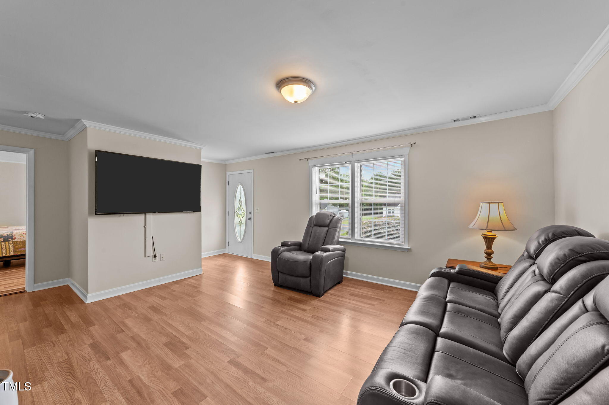 1425 Langdon Road Angier, NC 27501 - Photo 7 of 55 a living room with furniture window and a flat screen tv