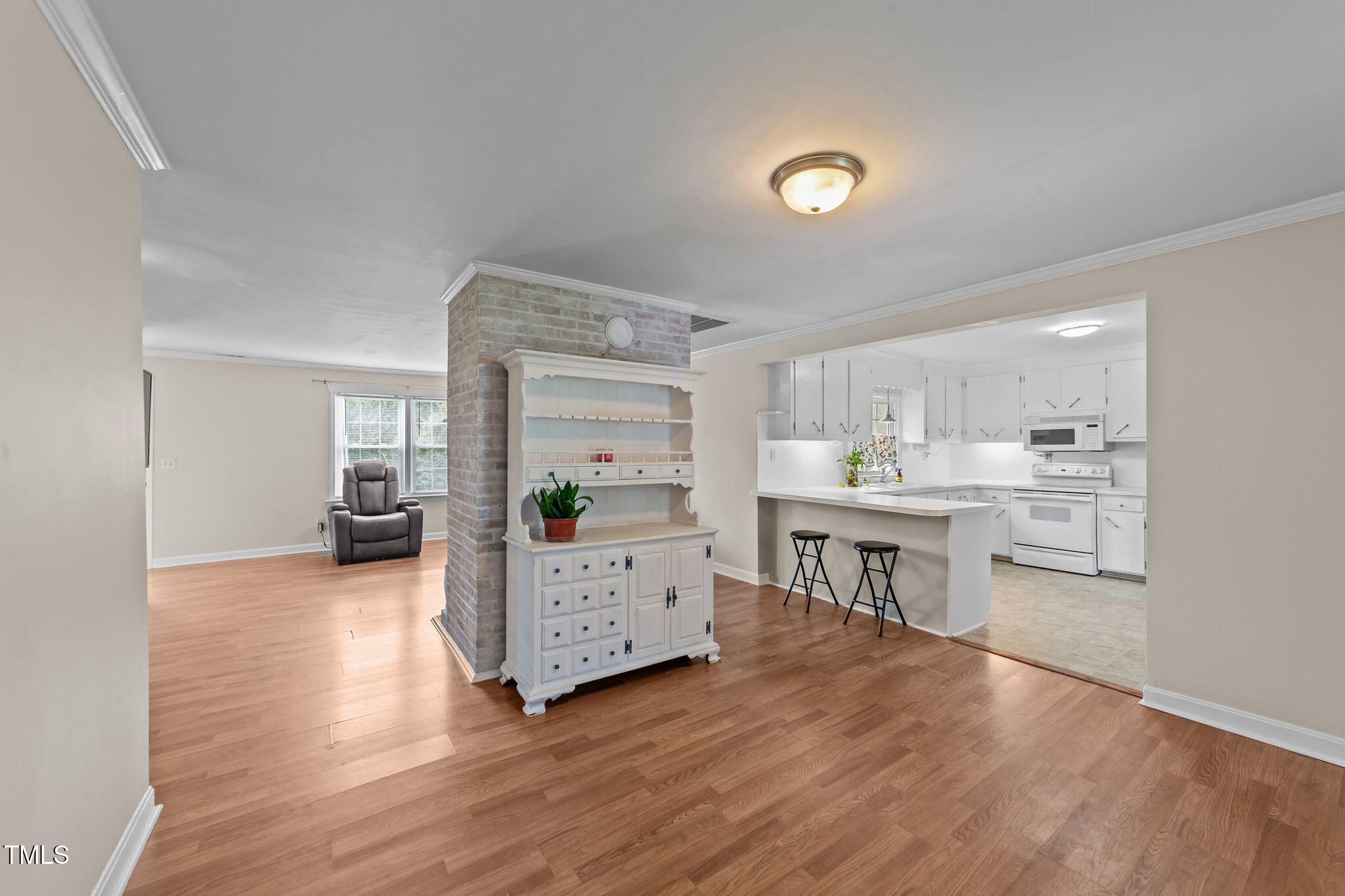 1425 Langdon Road Angier, NC 27501 - Photo 10 of 55 a kitchen with kitchen island white cabinets and counter space