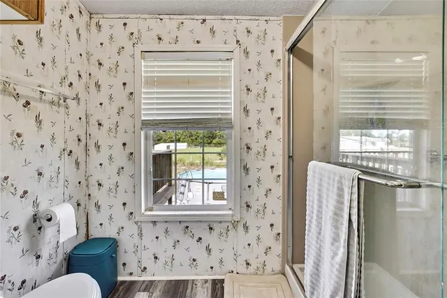 a view of a livingroom with furniture and wooden floor