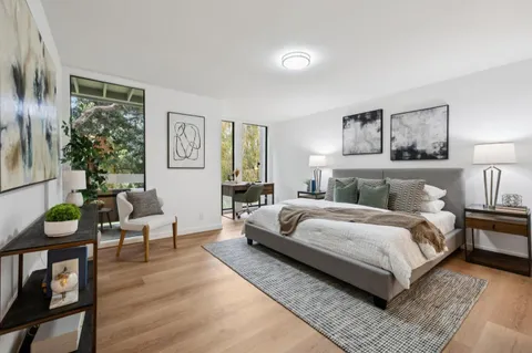 a bedroom with a bed and window