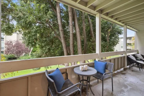 a view of a chairs and table in patio