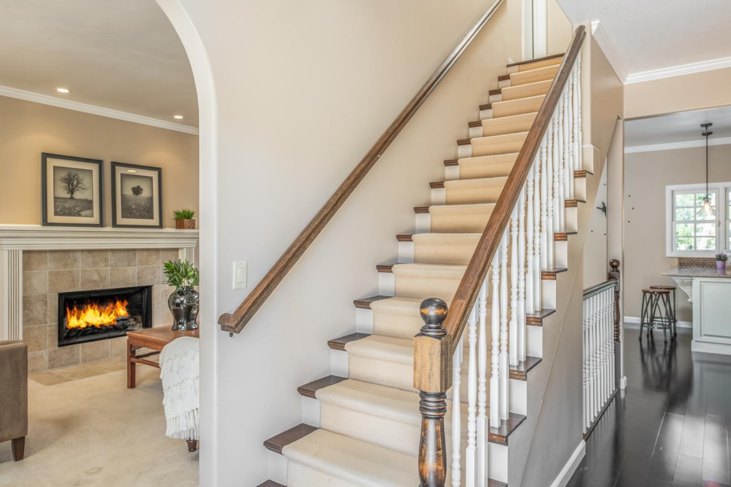 3602 Eastfield Road Carmel, CA 93923 - Photo 14 of 27 a view of a livingroom with wooden floor fireplace and stairs