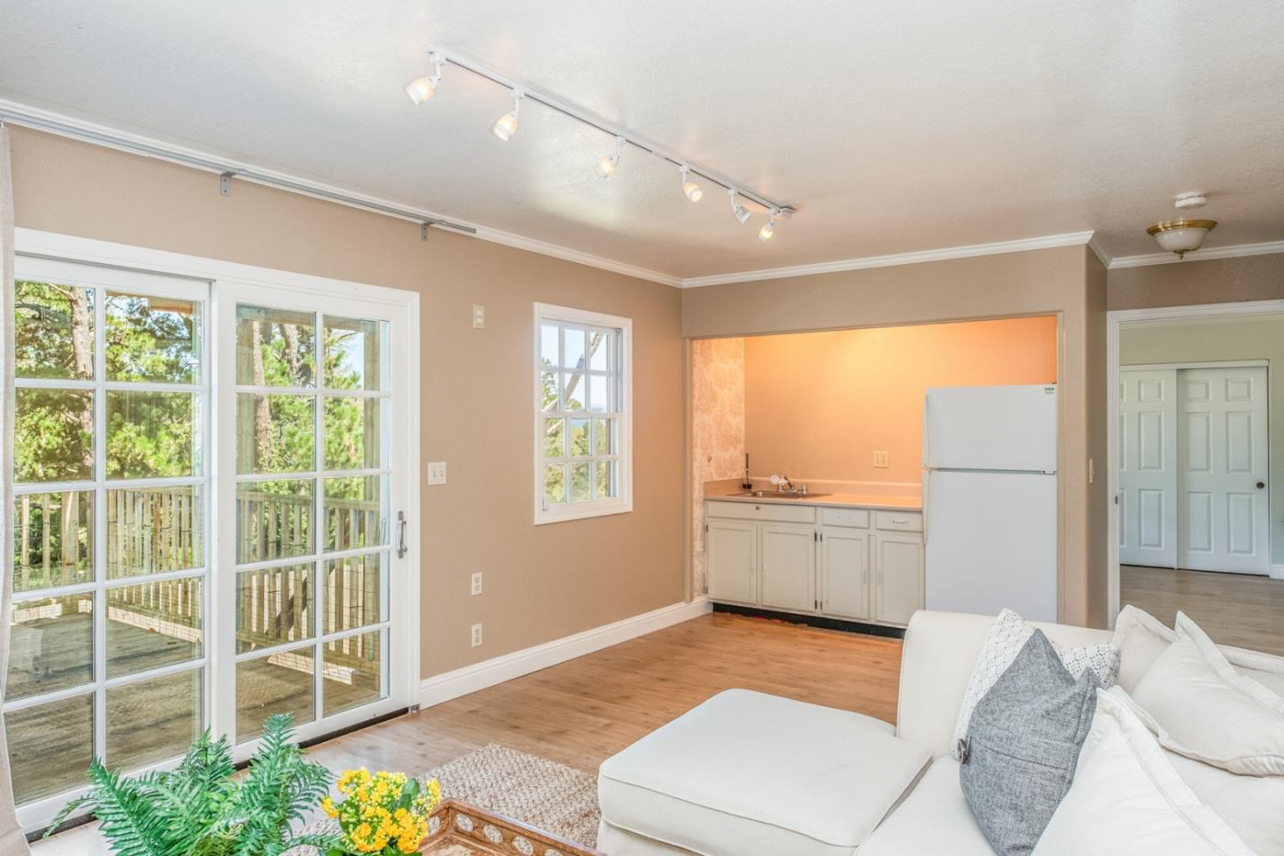3602 Eastfield Road Carmel, CA 93923 - Photo 21 of 27 a bathroom with a granite countertop sink a large mirror and a bathtub next to a window