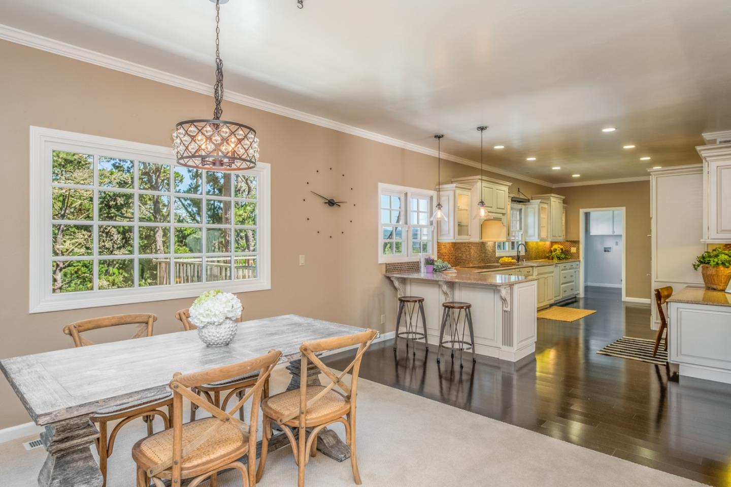 3602 Eastfield Road Carmel, CA 93923 - Photo 7 of 27 a dining room with furniture a chandelier and wooden floor