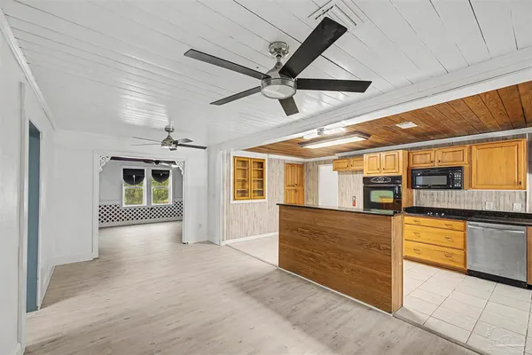 a view of a kitchen with furniture and a kitchen