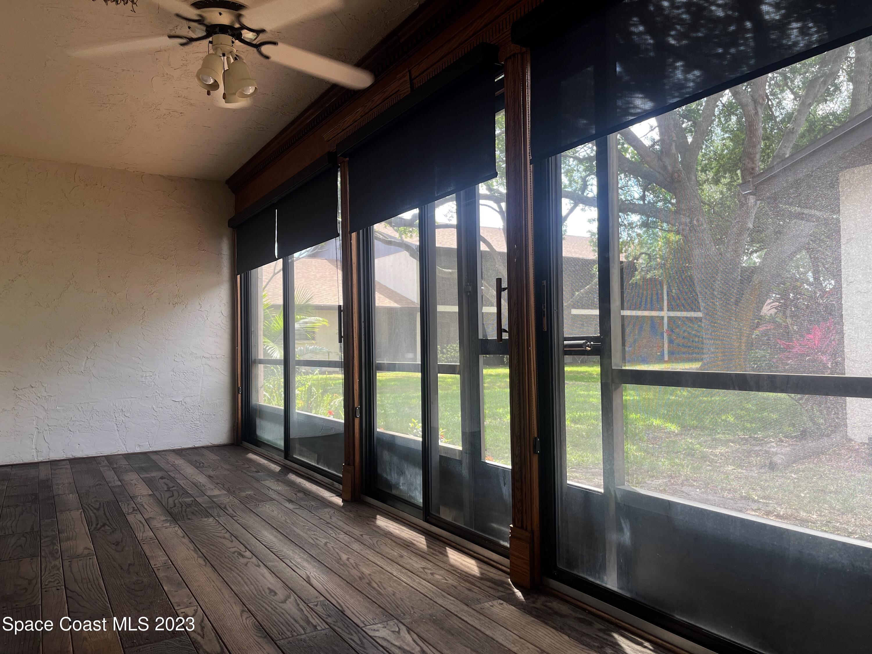 1675 South Fiske Boulevard, Unit 155 Rockledge, FL 32955 - Photo 11 of 24 a view of room with window and wooden floor