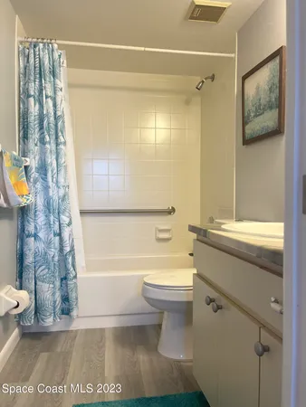 a bathroom with a toilet a sink and bathtub