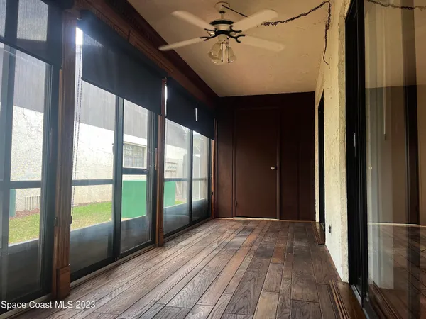 a view of gallery with wooden floor