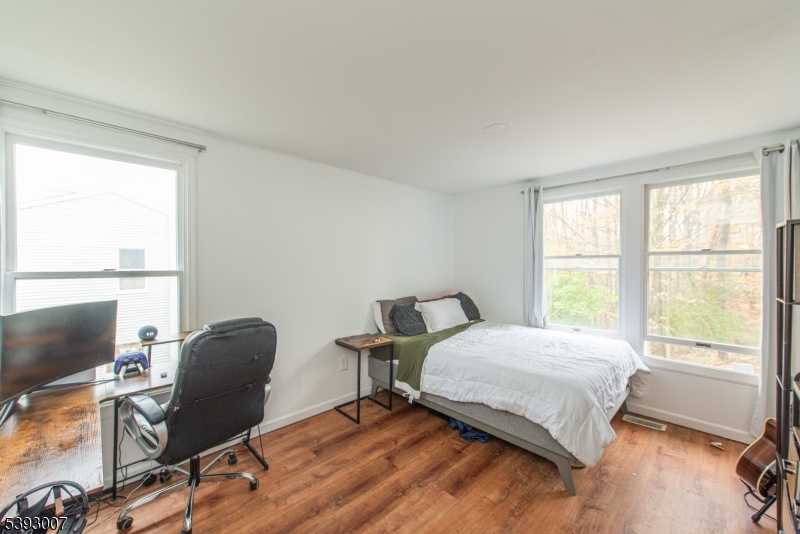 76 Constitution Way, Unit 76 Franklin, NJ 07416 - Photo 12 of 22 a bedroom with a bed chair and a window