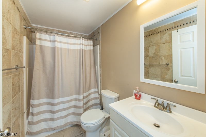 76 Constitution Way, Unit 76 Franklin, NJ 07416 - Photo 16 of 22 a bathroom with a sink toilet and shower