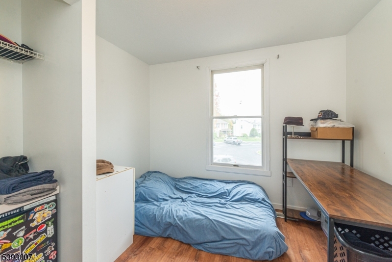 76 Constitution Way, Unit 76 Franklin, NJ 07416 - Photo 8 of 22 a bedroom with a bed and a window