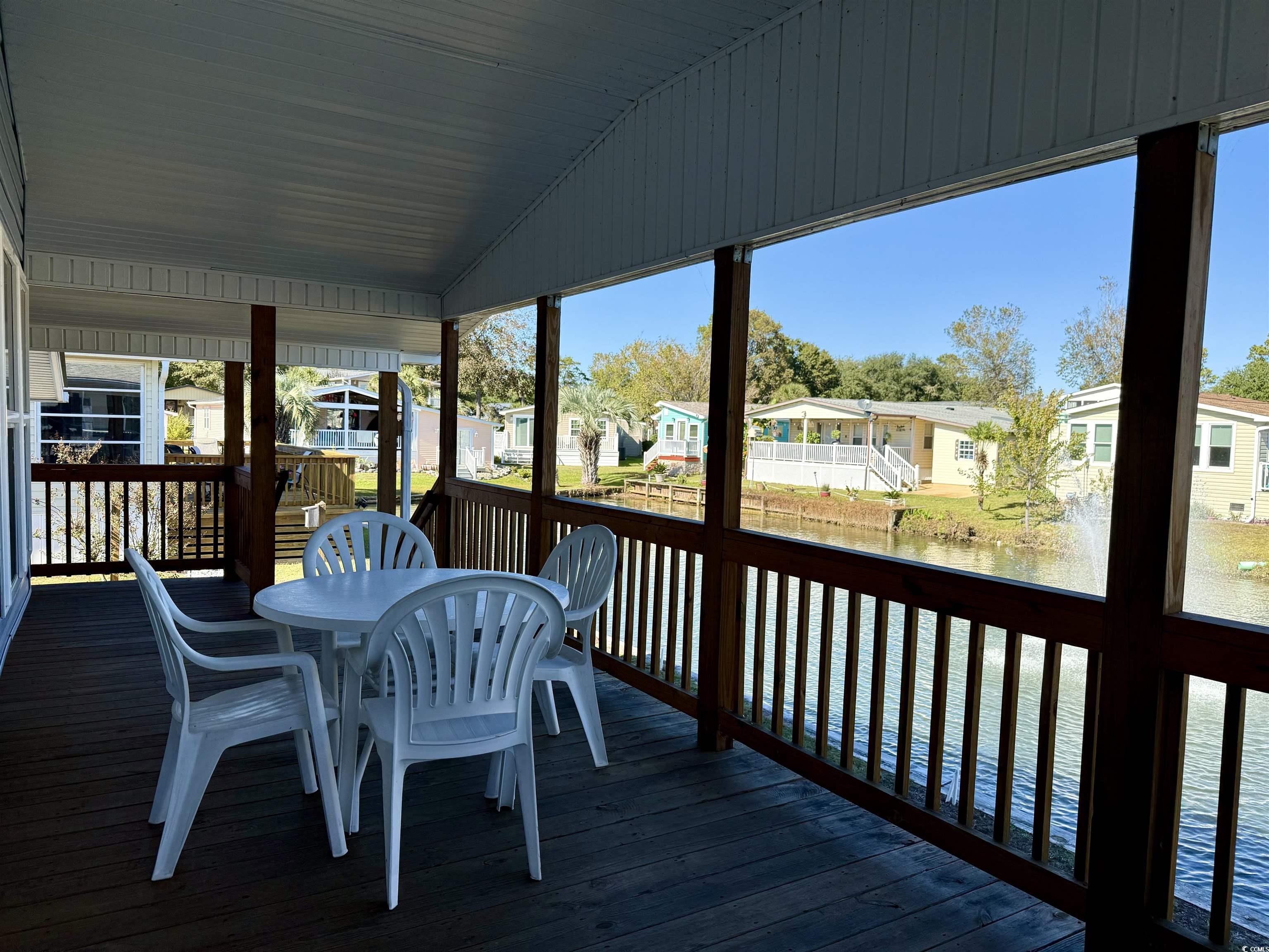 502 Sandpebble Surfside Beach, SC 29575 - Photo 26 of 31 Wooden terrace with a water view