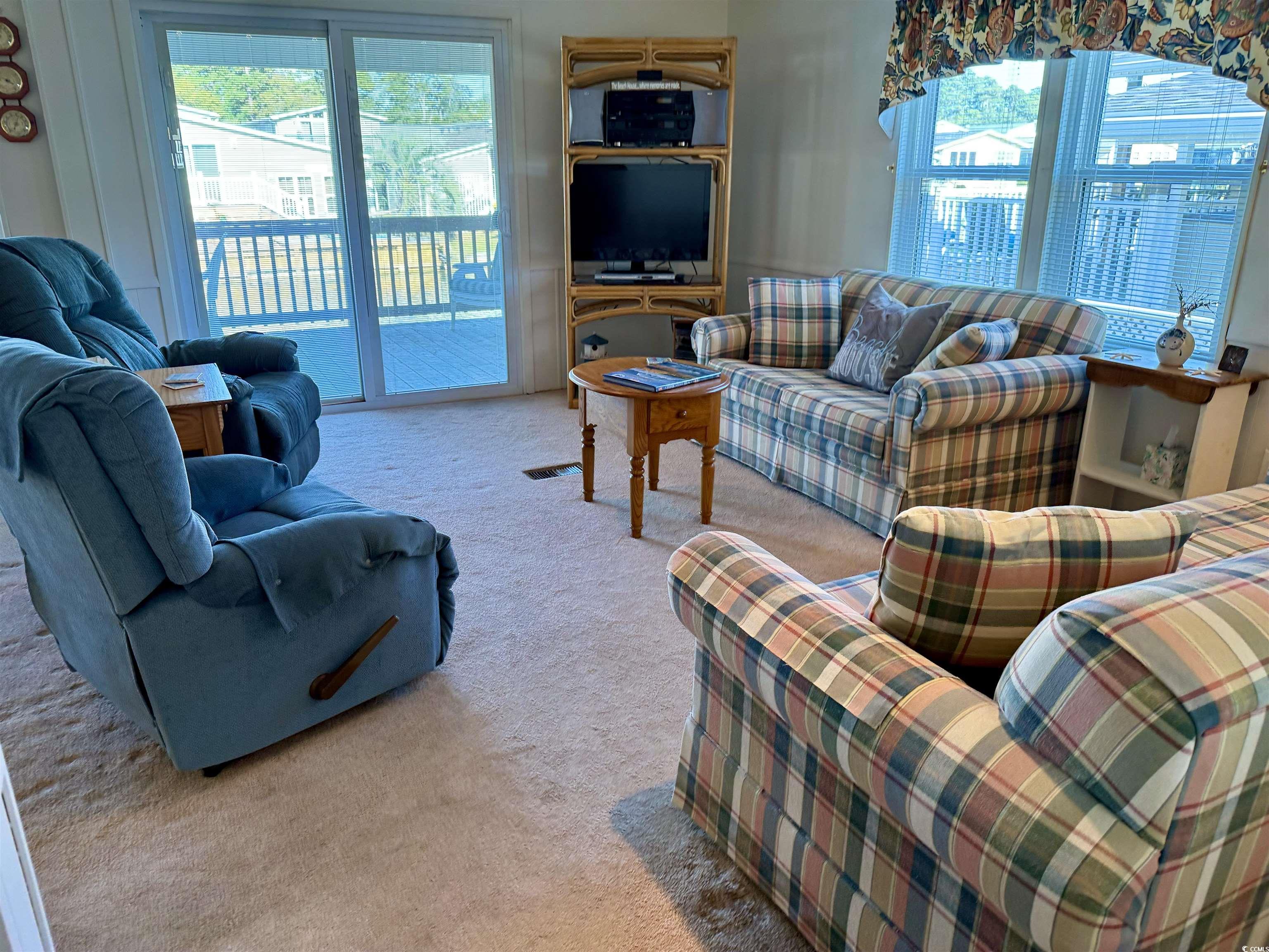 502 Sandpebble Surfside Beach, SC 29575 - Photo 8 of 31 Living room featuring carpet flooring