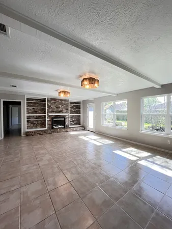 a view of a livingroom with furniture and windows
