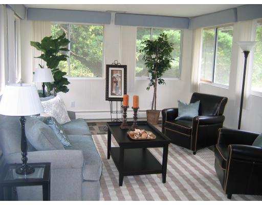 28 Wentworth Road Canton, MA 02021 - Photo 2 of 10 a living room with furniture and a potted plant