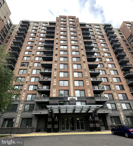 a tall building sitting on the side of a street