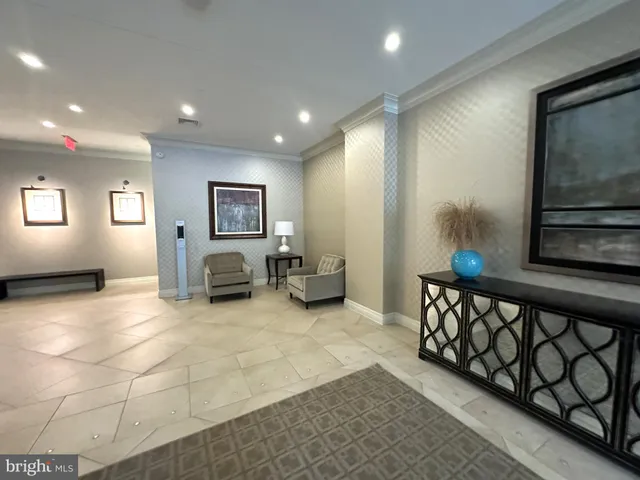 a view of a livingroom with furniture and windows