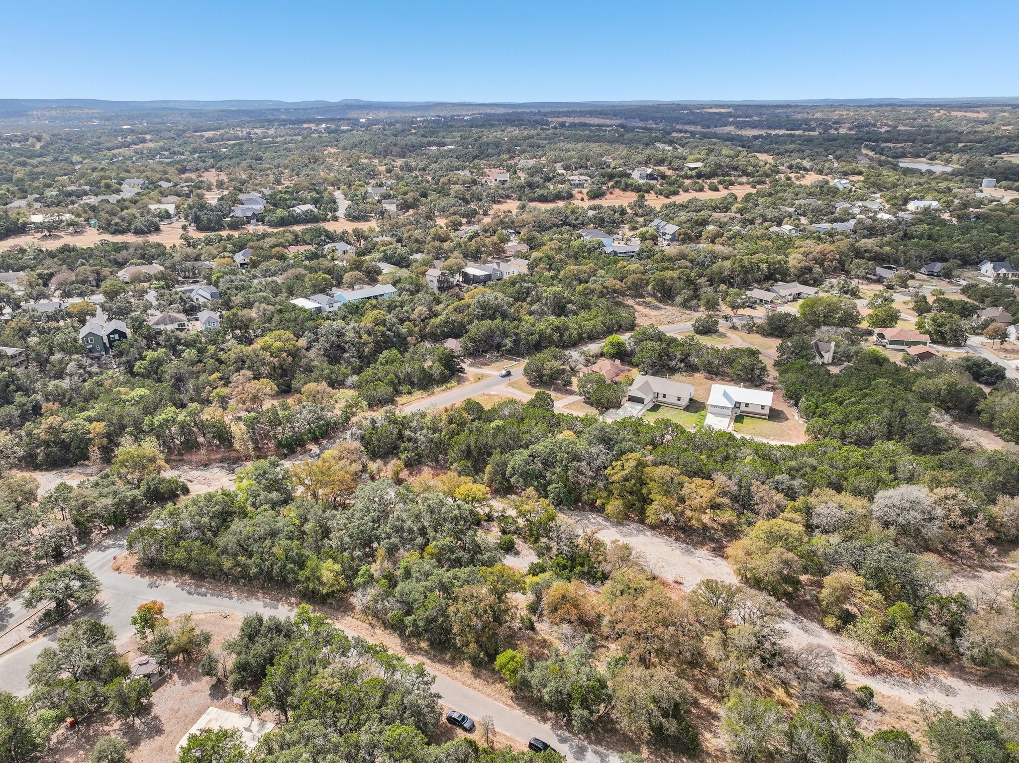 9 East Valley Spring Road Wimberley, TX 78676 - Photo 6 of 11 an aerial view of residential houses with city view