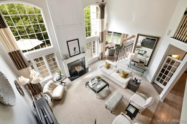 a living room with furniture fireplace and window